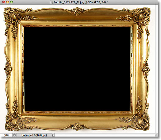 The area inside the photo frame has been filled with black. Image © 2011 Photoshop Essentials.com
