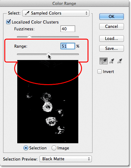 Lowering the Range value in the Color Range dialog box. Image © 2012 Photoshop Essentials.com