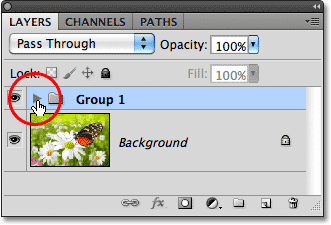 A new layer group named Group 1 appears in the Layers panel. Image © 2011 Photoshop Essentials.com