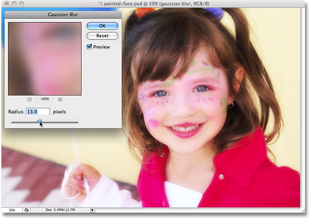 Photoshop pauses the action and displays the Gaussian Blur dialog box. Image used by permission from iStockphoto.com