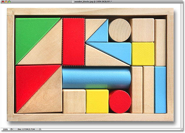 The wooden block is now selected. Image © 2009 Photoshop Essentials.com