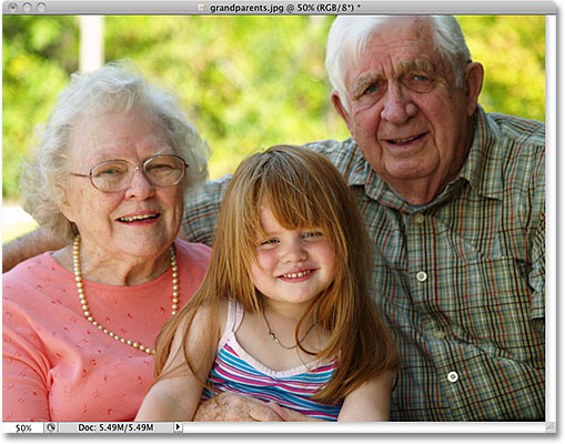 A photo of grandparents with their grand daughter. Image licensed from iStockphoto by Photoshop Essentials.com