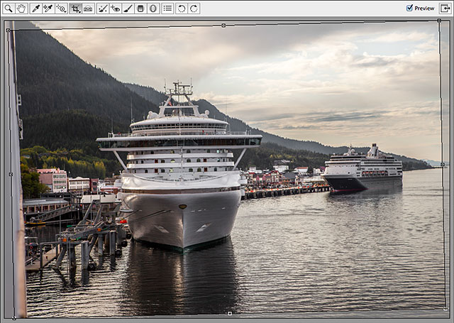 Camera Raw automatically draws a cropping border around the image. Image © 2013 Steve Patterson, Photoshop Essentials.com