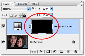 The layer mask for the adjustment layer has been filled with black.  Image © 2008 Photoshop Essentials.com.
