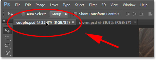Dragging the photo onto the other tab. Image © 2013 Photoshop Essentials.com
