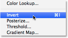 Selecting the Invert command. Image © 2014 Photoshop Essentials.com.