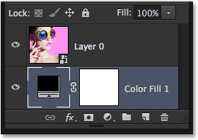 The Solid Color fill layer has been moved below the image layer. Image © 2014 Photoshop Essentials.com.