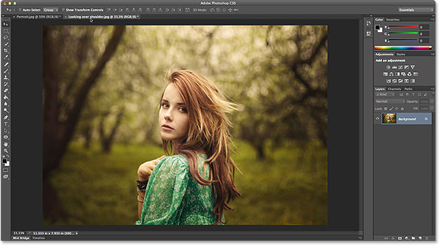 Making the landscape-oriented photo active by clicking its name tab. Image © 2014 Photoshop Essentials.com