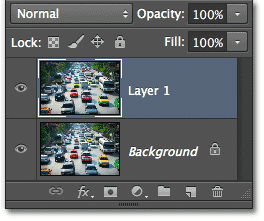 Layer 1 appears above the Background layer. Image © 2012 Photoshop Essentials.com