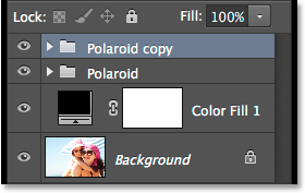 The Layers panel showing two polaroid layer groups. Image © 2014 Photoshop Essentials.com