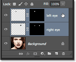 Selecting both of the eye layers. Image © 2014 Photoshop Essentials.com.