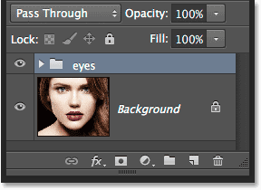 The two eye layers are now inside a single layer group. Image © 2014 Photoshop Essentials.com.