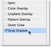 Selecting Drop Shadow in the list of layer effects in the Layer Style dialog box. Image © 2014 Photoshop Essentials.com.