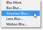 Selecting the Gaussian Blur filter from under the Filter menu. Image © 2013 Photoshop Essentials.com