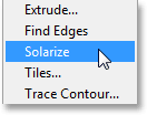Selecting the Solarize filter from under the Filter menu. Image © 2013 Photoshop Essentials.com