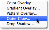 Choosing an Outer Glow layer style. Image © 2012 Photoshop Essentials.com