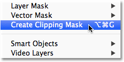 Selecting the Create Clipping Mask command from the Layer menu in Photoshop. Image © 2012 Photoshop Essentials.com