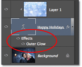 The Layers panel showing the Outer Glow style added to the Type layer. Image © 2012 Photoshop Essentials.com