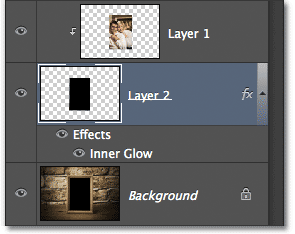 The Layers panel showing the Inner Glow style added to Layer 2. Image © 2012 Photoshop Essentials.com