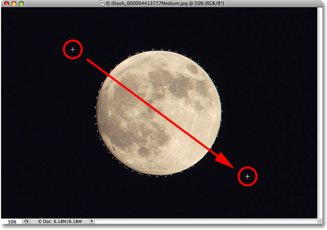 Drawing an elliptical selection around the moon. Image © 2009 Photoshop Essentials.com