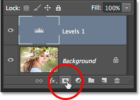 Adding a layer mask manually to the Levels adjustment layer. Image © 2014 Steve Patterson, Photoshop Essentials.com