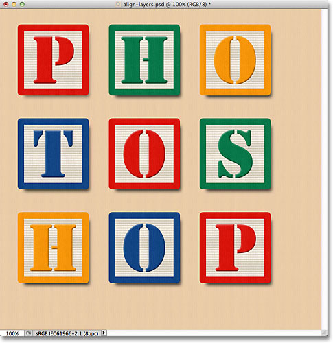 The blocks have now been aligned and distributed in the document. Image © 2011 Photoshop Essentials.com