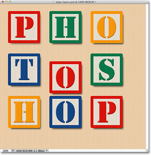 The block in the middle center becomes visible in the document. Image © 2011 Photoshop Essentials.com