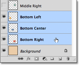 Selecting three layers at once in the Layers panel in Photoshop. Image © 2011 Photoshop Essentials.com