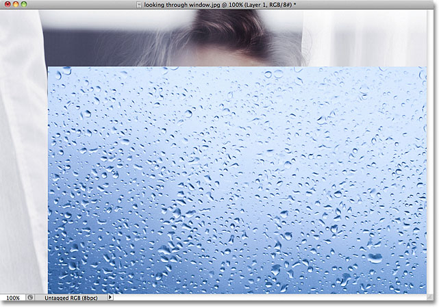 The photo is not centered in the other Photoshop document. Image © 2011 Photoshop Essentials.com