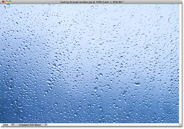 The photo was moved to the new document and placed in the center. Image © 2011 Photoshop Essentials.com