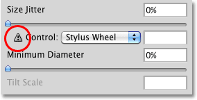 A warning icon appears when I choose Stylus Wheel. Image © 2010 Photoshop Essentials.com