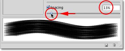 Lowering the brush Spacing amount in the Brushes panel in Photoshop. Image © 2010 Photoshop Essentials.com