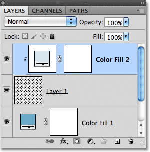 The fill layer has been clipped to Layer 1. Image © 2011 Photoshop Essentials.com