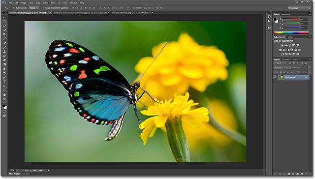 The floating documents have been consolidated to tabs. Image © 2013 Photoshop Essentials.com