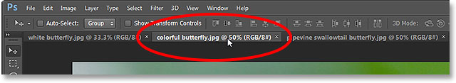 Selecting the middle tabbed document. Image © 2013 Photoshop Essentials.com