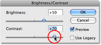 Increasing the Contrast value to +70. Image © 2009 Photoshop Essentials.com.