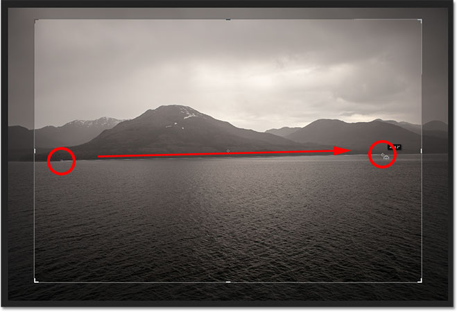 Click and drag along something that should be straight in the photo. Image © 2012 Photoshop Essentials.com