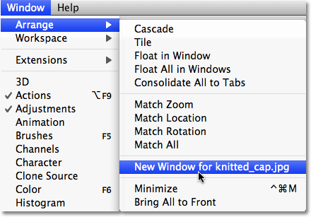 Selecting the Window - Arrange - New Window option in Photoshop. Image © 2009 Photoshop Essentials.com