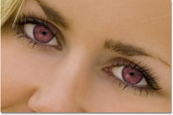 The eyes now appear red after changing their color in Photoshop. Image © 2010 Photoshop Essentials.com
