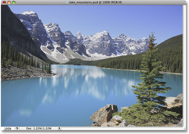 A photo of a lake and mountains. Image licensed from iStockphoto by Photoshop Essentials.com.