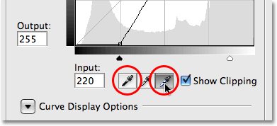 The Black and White Eyedroppers in the Curves dialog box in Photoshop CS3. Image © 2009 Photoshop Essentials.com.