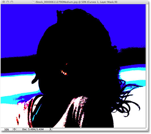 Dragging the white point slider with Show Clipping enabled in Photoshop CS3. Image © 2009 Photoshop Essentials.com.