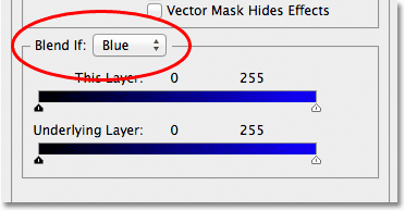 Changing the Blend If option from Gray to Blue in the Layer Style dialog box. Image © 2012 Photoshop Essentials.com