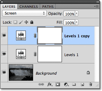 A copy of the Levels adjustment layer appears above the original in the Layers panel. Image © 2011 Photoshop Essentials.com