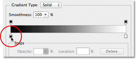 Editing the black color stop in the Gradient Editor. Image © 2012 Photoshop Essentials.com.