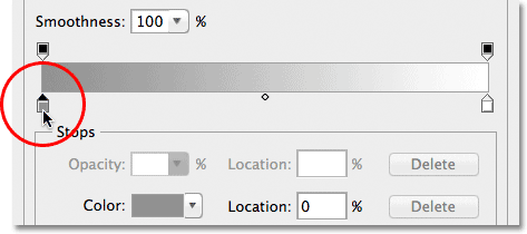 Double-clicking the gray color stop in the Gradient Editor. Image © 2012 Photoshop Essentials.com.