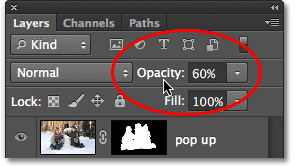 Lowering the layer opacity. Image © 2012 Photoshop Essentials.com.