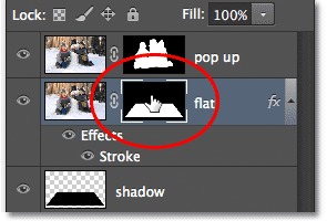 Selecting the layer mask by clicking on the mask thumbnail. Image © 2012 Photoshop Essentials.com.