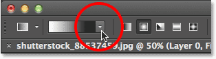 Clicking the triangle icon to the right of the gradient preview bar in the Options Bar. Image © 2013 Photoshop Essentials.com