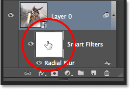 Selecting the layer mask for the Smart Filters in the Layers panel. Image © 2013 Photoshop Essentials.com